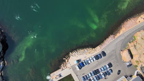 Cars-Parked-At-The-Parking-Lot-At-The-Coast-Of-Lysekil-In-Bohuslan,-Sweden