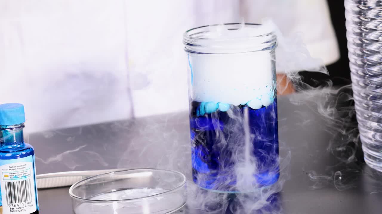 Dry ice reacts with water, creating smoke