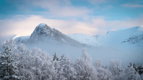 incomming mist in the snowy mountains