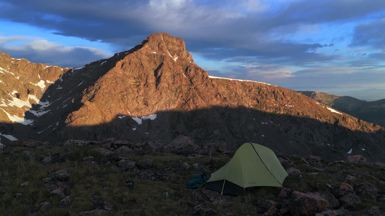 Mount of the Holy Cross 14er peak first light summer morning sunrise aerial drone Bowl of Tears Lake Sawatch Range Halo Ridge trail Notch Mountain Rocky Mountain snow on summit North ridge circle left