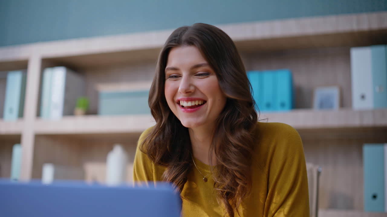 Woman manager making notes at home workplace closeup. Happy freelancer rejoicing