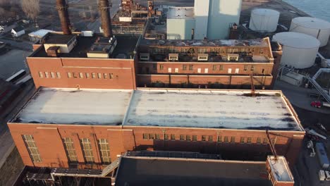 an old industrial power plant in detroit, michigan during the golden hour.-aerial shot