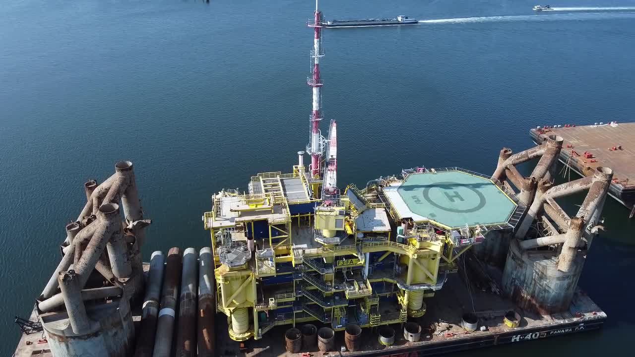 Aerial footage of a power rig in maintenance in the port of Rotterdam.