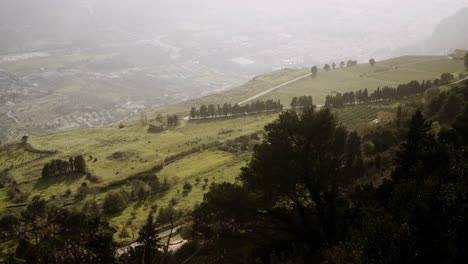 mountainous landscape with fields and houses