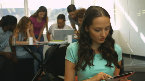 student using tablet and smiling