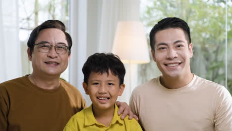 asian men and boy in the living room