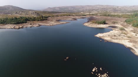 aerial shot of a reservoir with low water levels