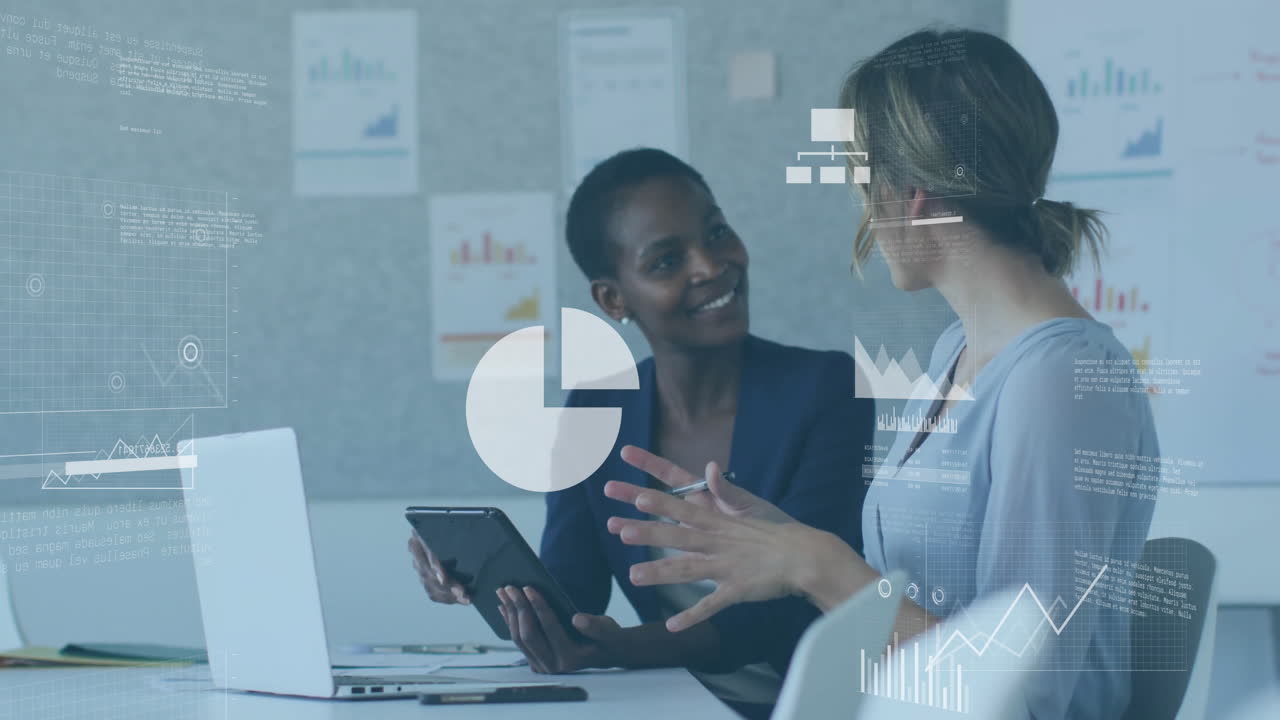 Discussing data, businesswomen with tablet and laptop over financial charts animation in office