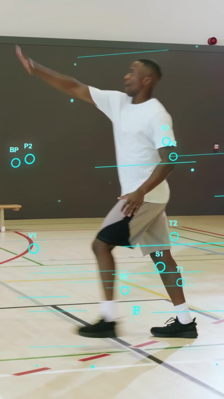 Vertical video: Drive triggers man in white pivoting, shooting to score while sports AR tracks shot