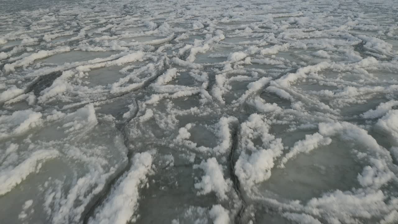 Thick ice sheet across surface of water Aerial