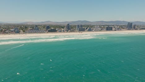 Drone-view-from-the-sea-of-Blouberg-with-in-front-kitesurfers