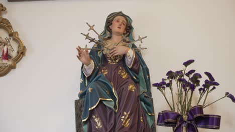 close up of religious virgin mary statue pierced by seven sorrowful swords