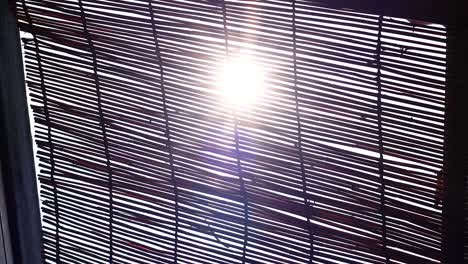 sunlight filtering through a slatted roof structure