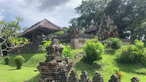 Handheld-shot-of-an-ancient,-Temple-in-Asia-in-green-park