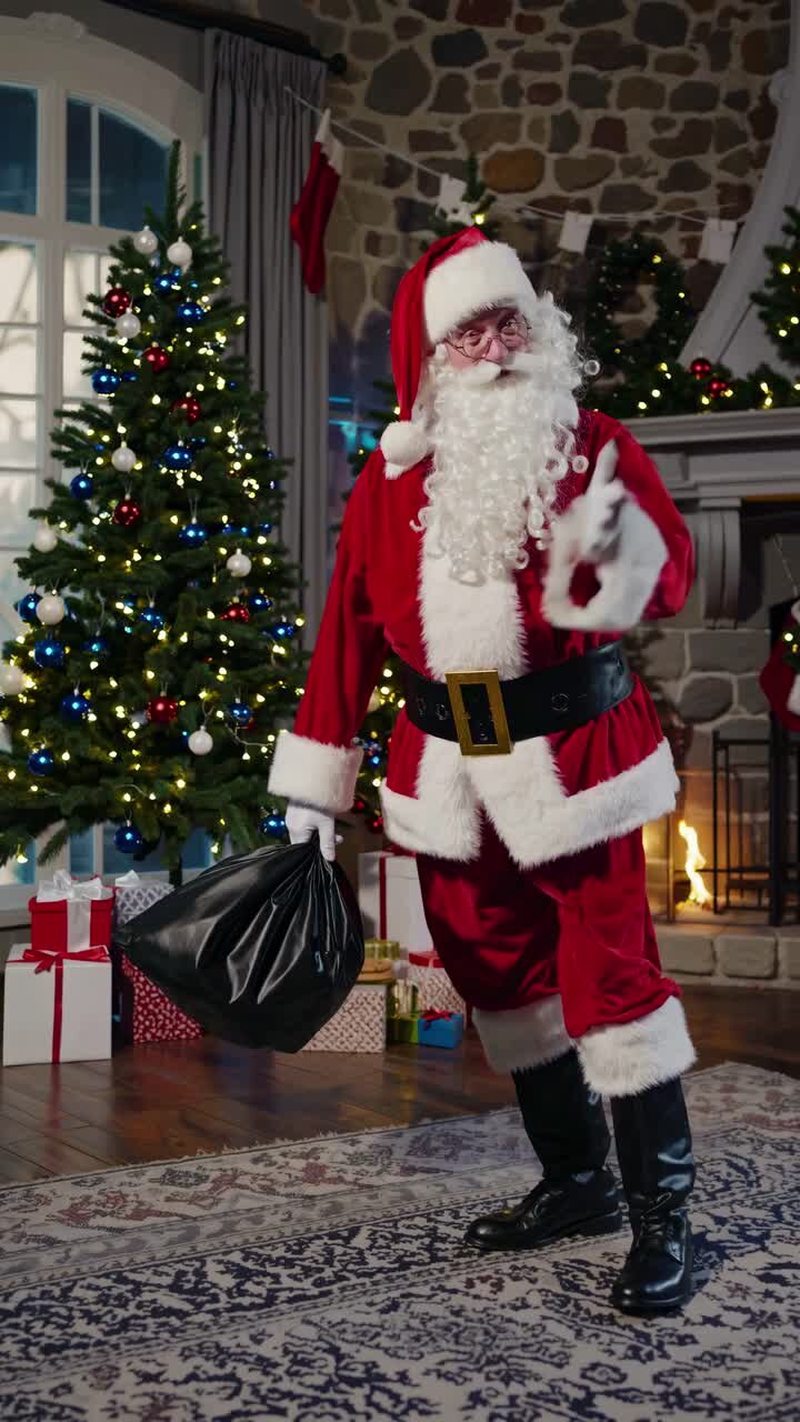 Festive video of Santa in a cozy room, surrounded by lit trees and gifts