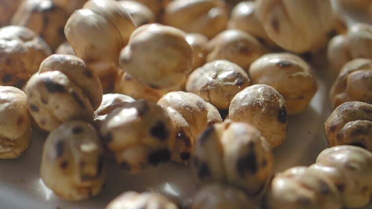 Close-up of Roasted Chickpeas Falling in Slow Motion