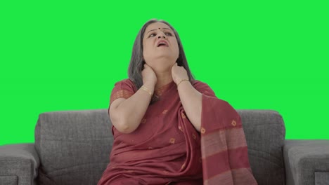 sick indian old woman suffering from neck pain green screen