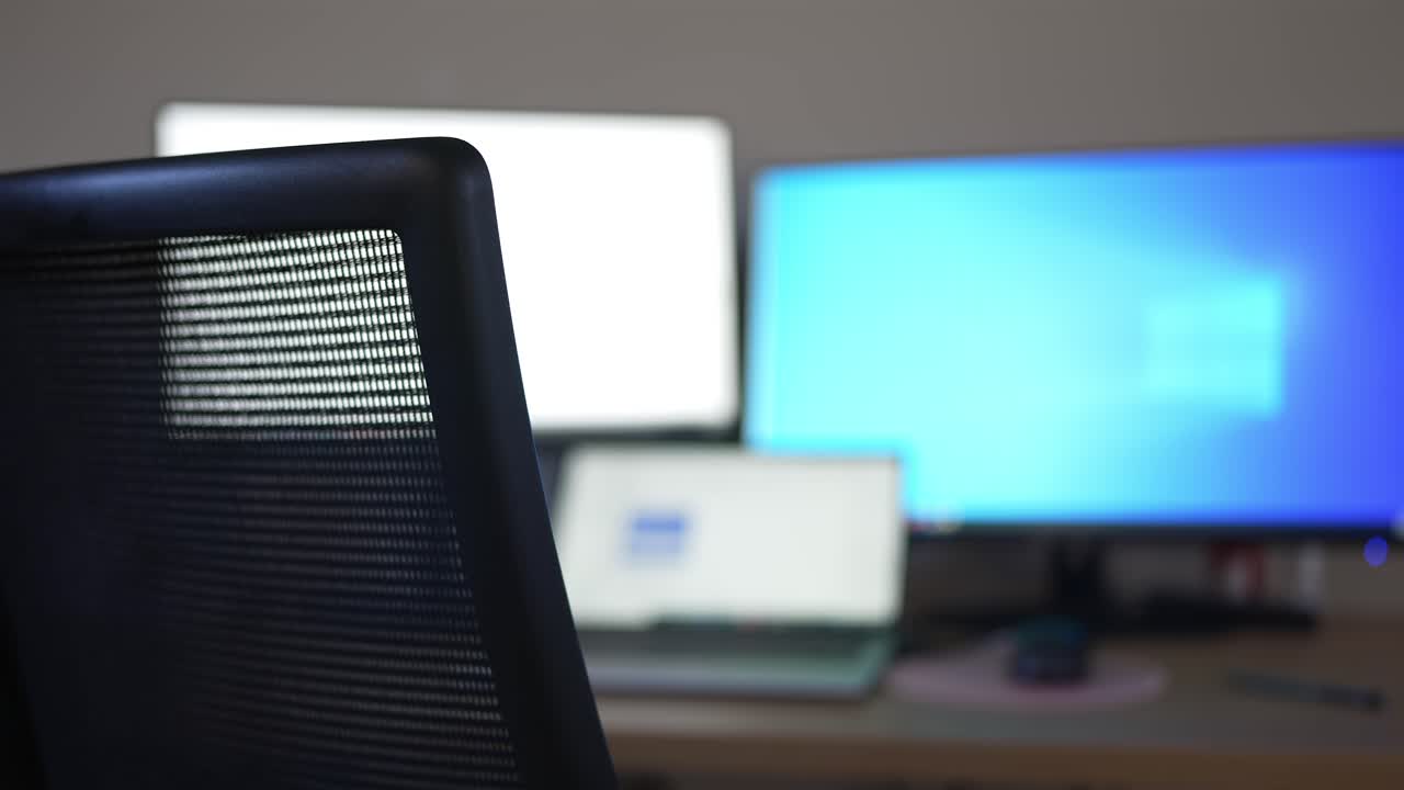 Empty Desk with Monitors in Office Space