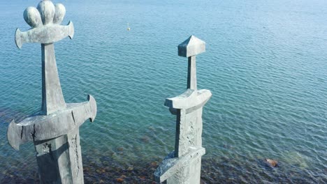 three viking swords sculpture by the sea