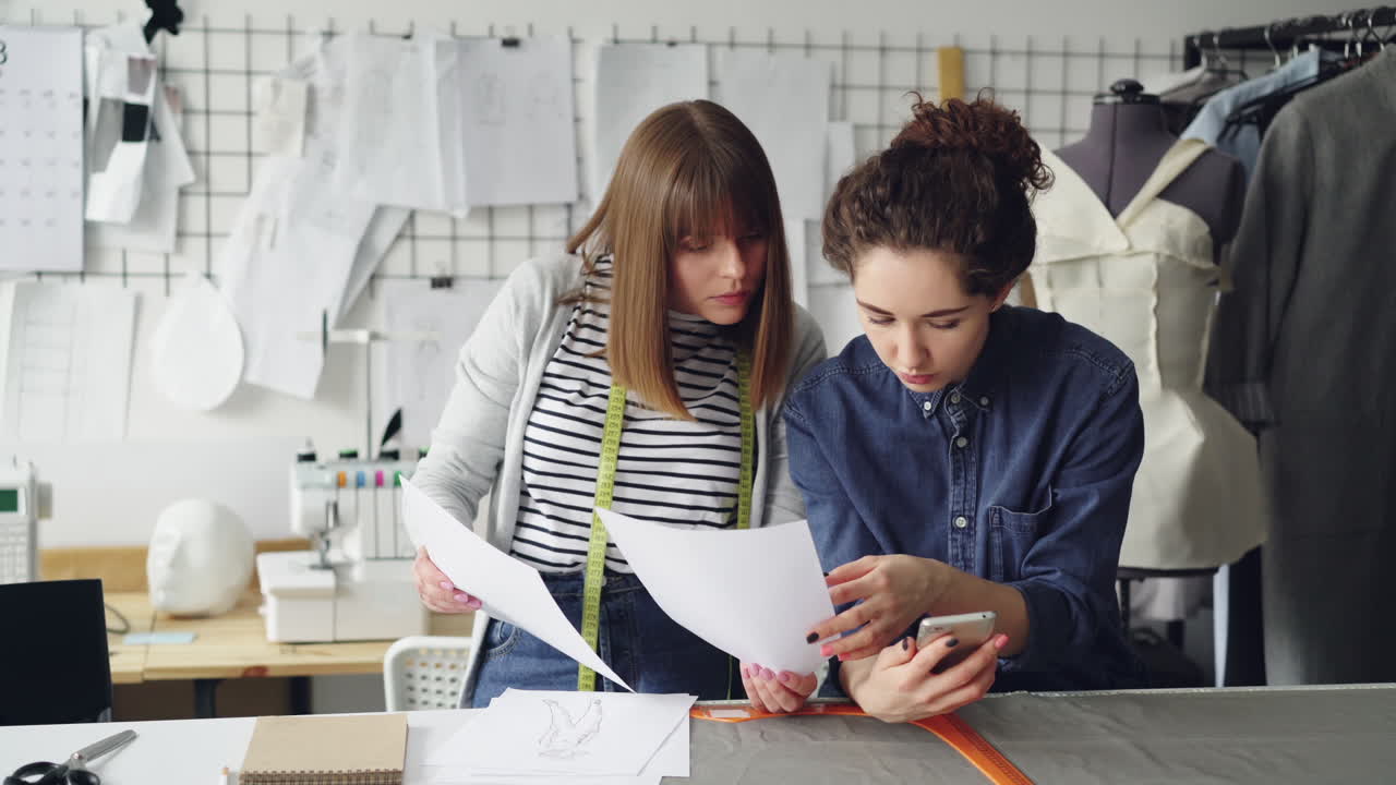 Fashion Designers Collaborating in a Studio