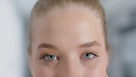 close up of portrait of happy caucasian female doctor with blonde hair, copy space, slow motion