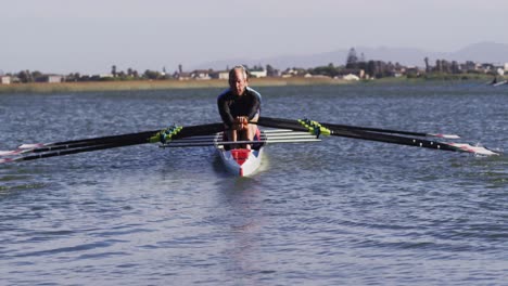 Four-senior-caucasian-men-and-women-rowing-boat-on-a-river