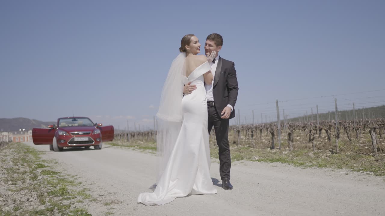 Bride and Groom on a Country Road at their Wedding