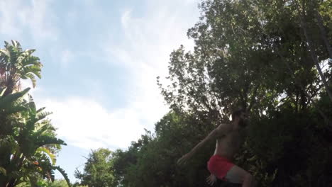 handsome man diving into swimming pool