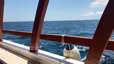 Broadside-view-of-sailboat-on-Mediterranean-sea-while-sailing-in-deep-waters-in-Sithonia,-Greece-in-4k