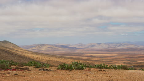 timelapse of desert landscape and clouds in morocco, static shot from tripod