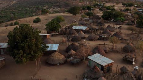 drone aerial view of secluded hamlet of kara tribe near omo riverbanks in southern ethiopia