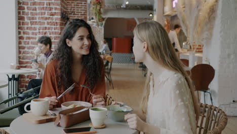 friends enjoying lunch in a stylish cafe