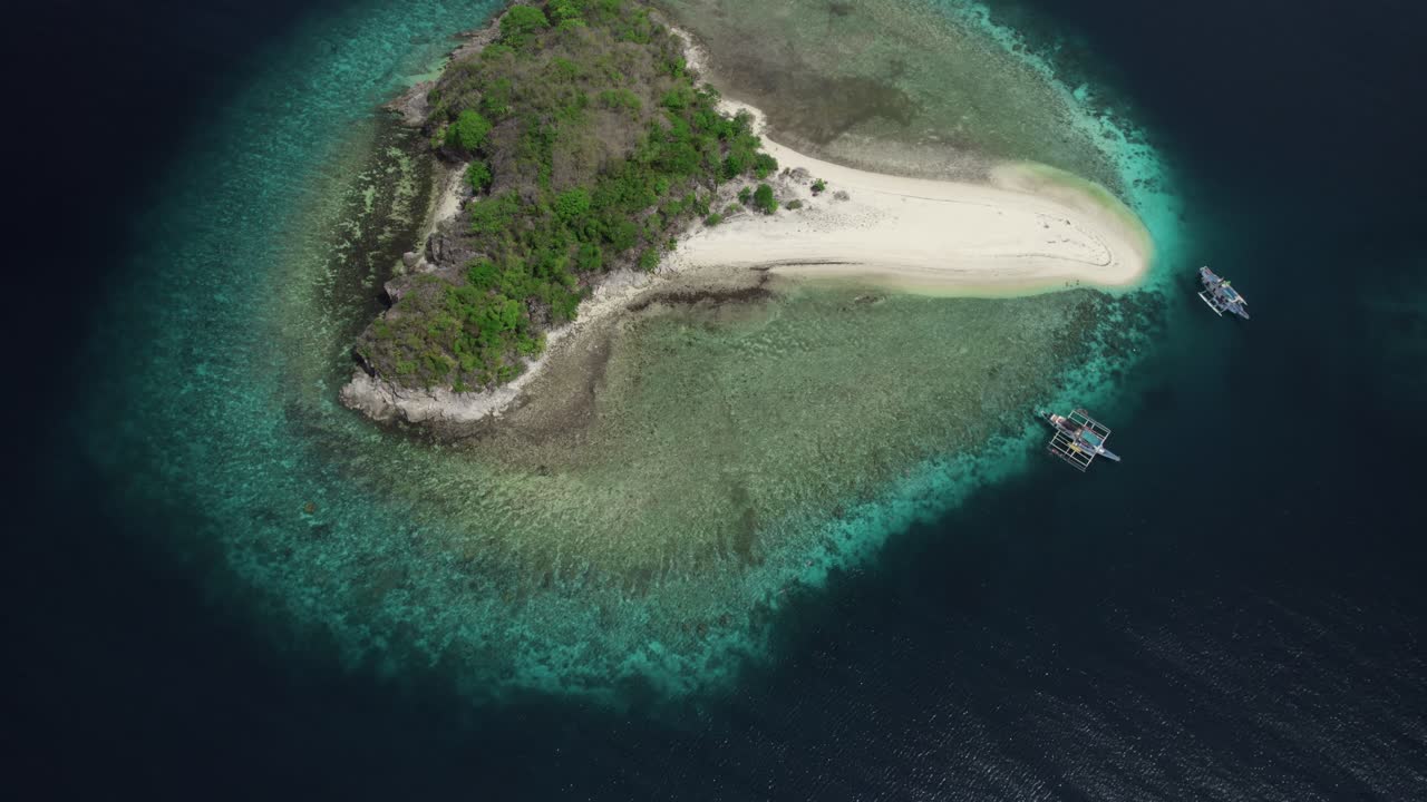 Pristine tropical island in Philippines, surrounded by turquoise waters and coral reefs, showcasing untouched sandy shores and lush greenery, with traditional boats nearby, a perfect paradise view.