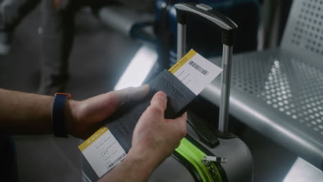 traveler with passport and boarding pass at airport