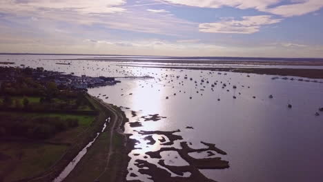 aerial footage of west mersea island harbour at sunset, this could show any harbour-port in the uk