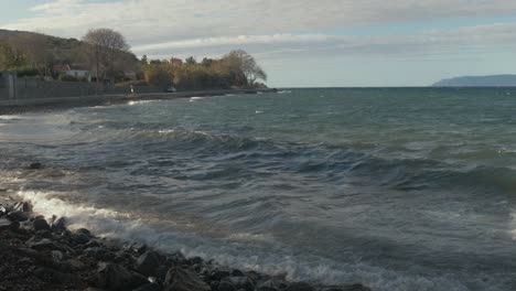 waves crashing along the shore of skala sikamineas