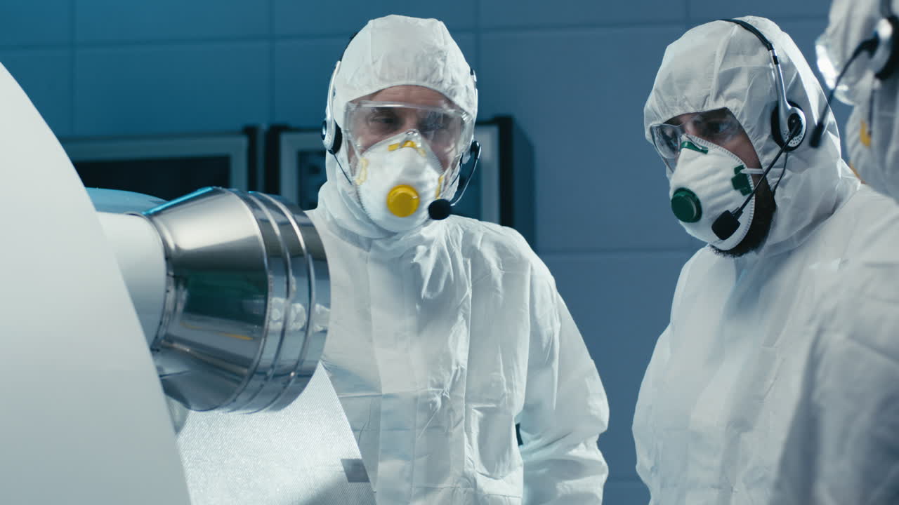 Industrial Team Inspecting Machinery