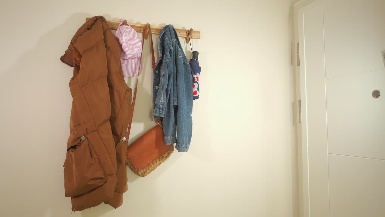 Clothes and accessories hanging on a coat rack
