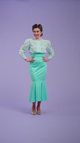 elegant woman in vintage-style mint green skirt and polka dot blouse