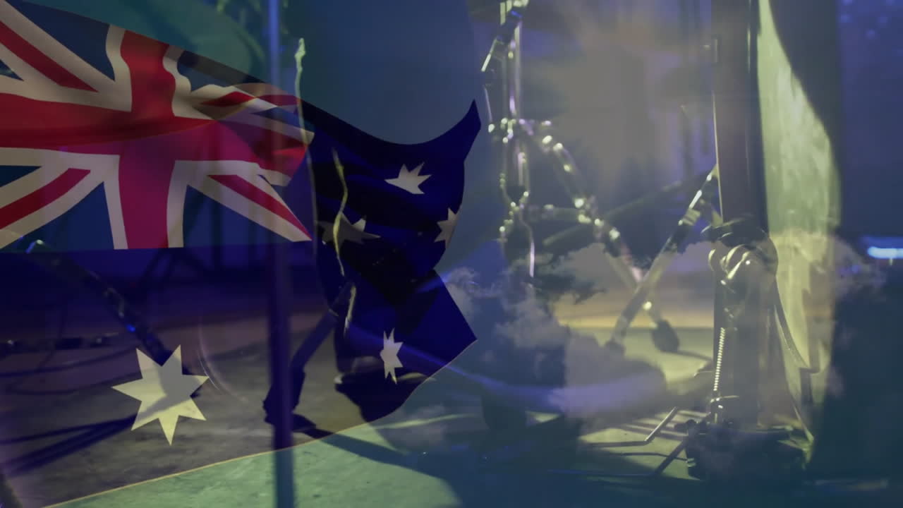 오스트레일리아의 발의 애니메이션 카우카시안 남자가 드럼을 연주하고 있습니다.