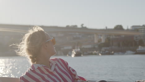 woman on a boat at sunset