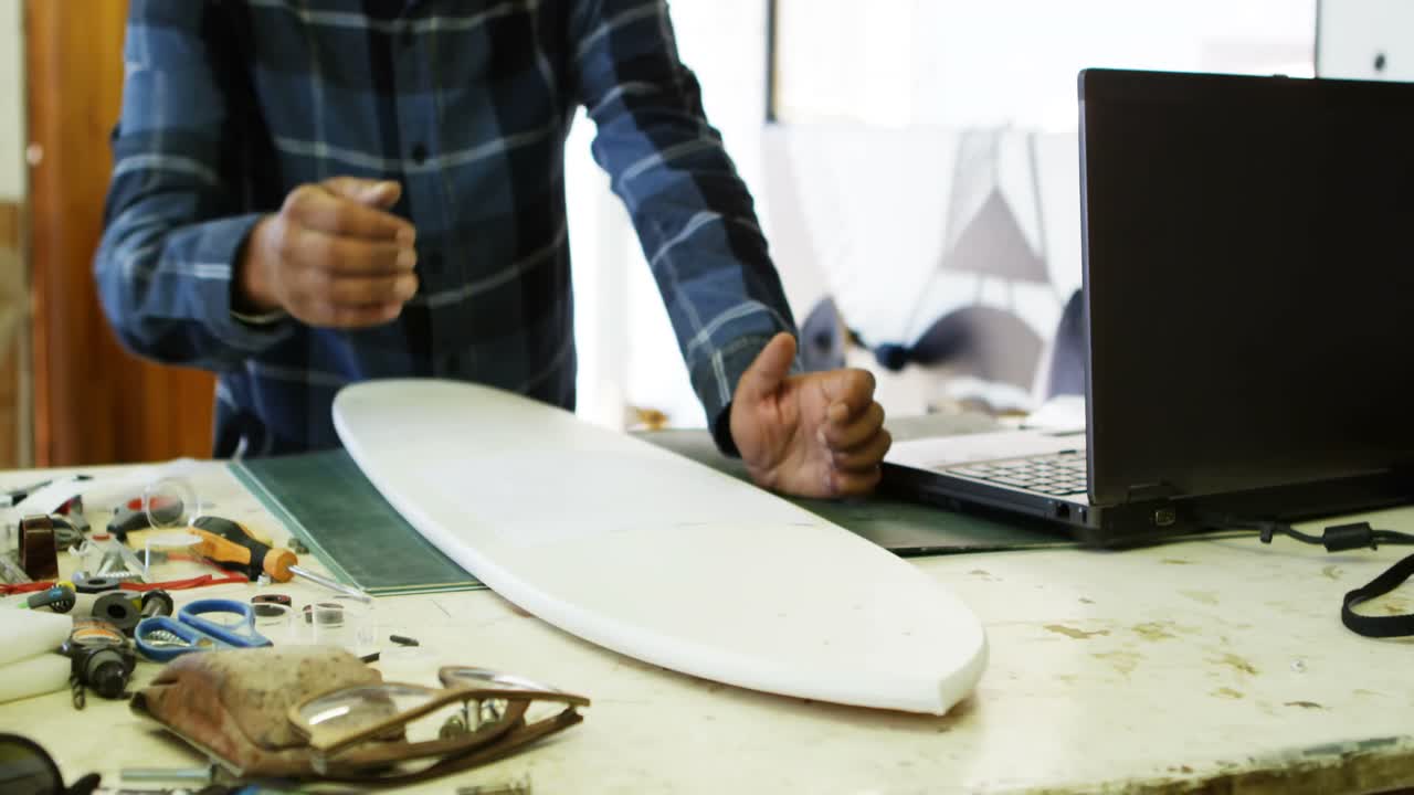 Man using sellotape for making skateboard 4k