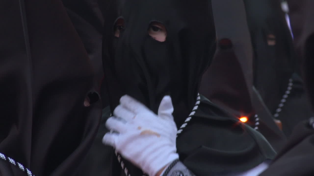 Religious Procession in Black Hooded Garments