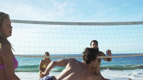 friends playing beach volleyball