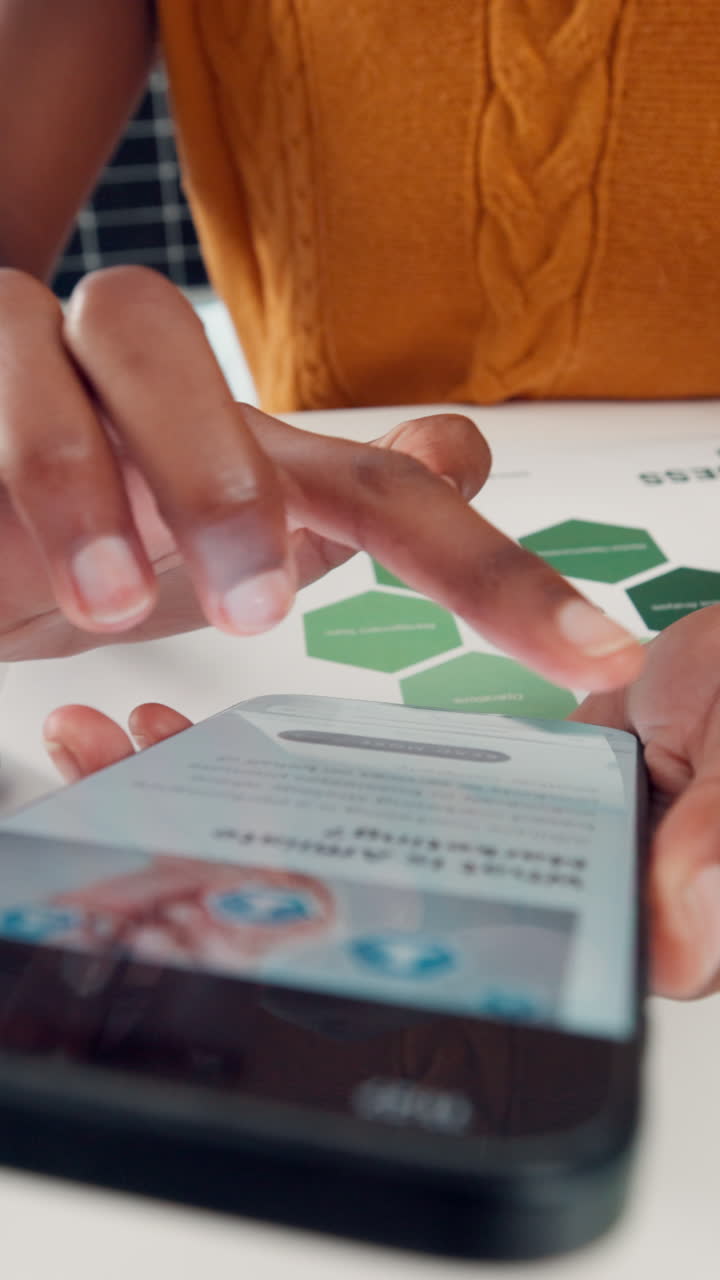 Close-Up of Person's Hands Scrolling on Smartphone with Business Document