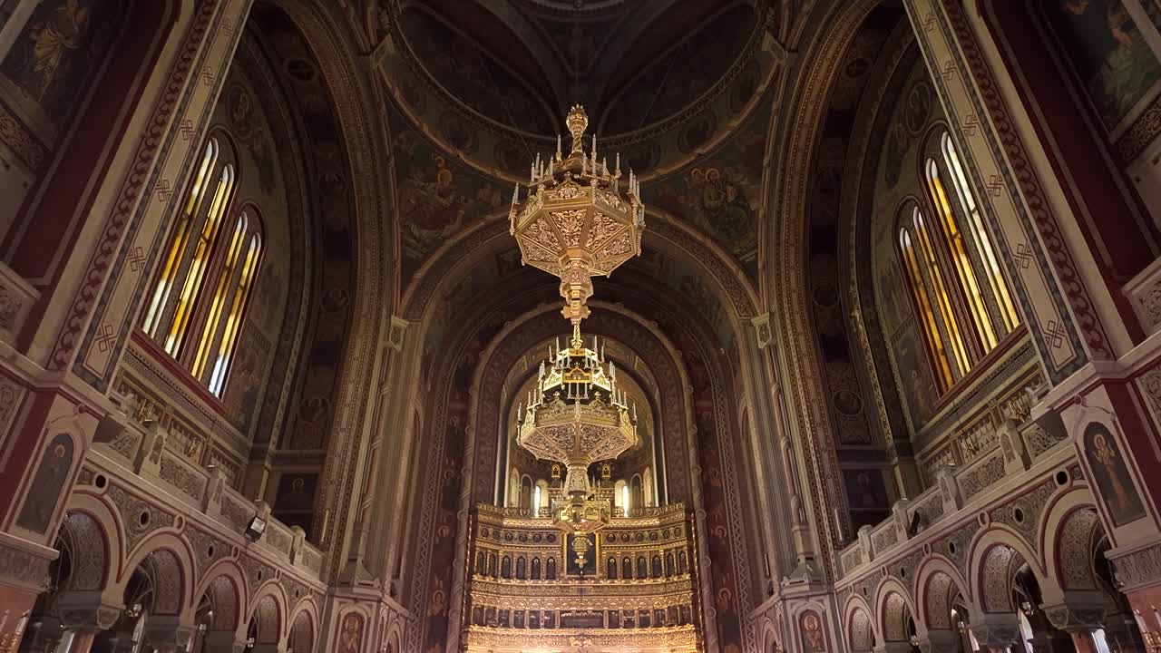 Beautiful interior view of the cathedral in Timisoara, featuring a grand chandelier and intricate architectural details