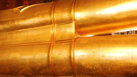 golden buddha statue in wat pho temple, bangkok