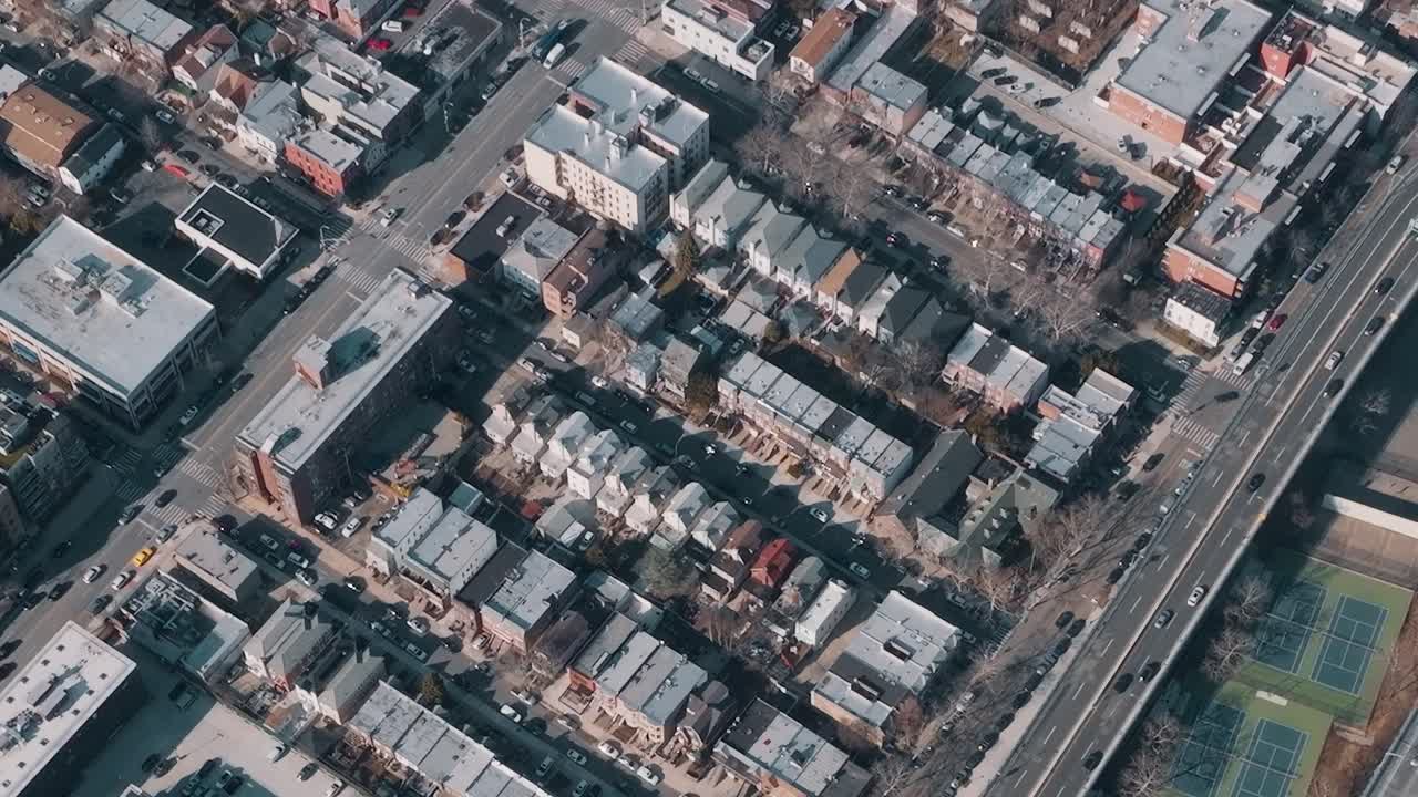 View of city blocks with buildings and parking in New York