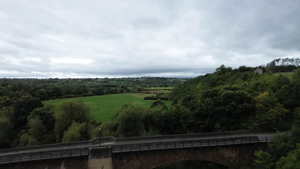 Bridge over a river surrounded by trees