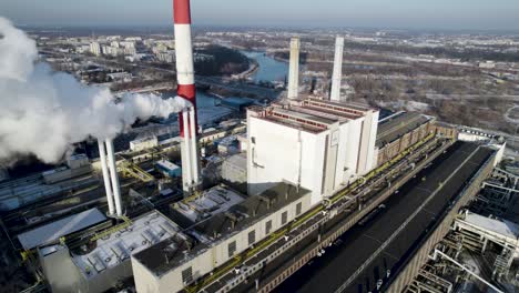 Aerial-dolly-back-view-from-gas-turbine-plant-during-winter